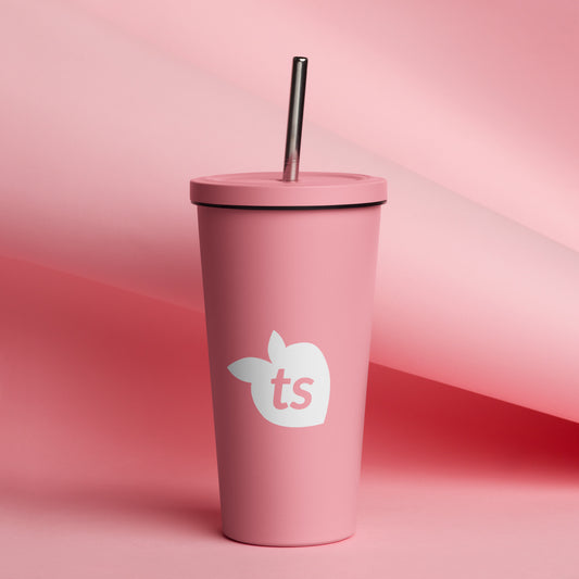 Pink tumbler with a straw on a pink background